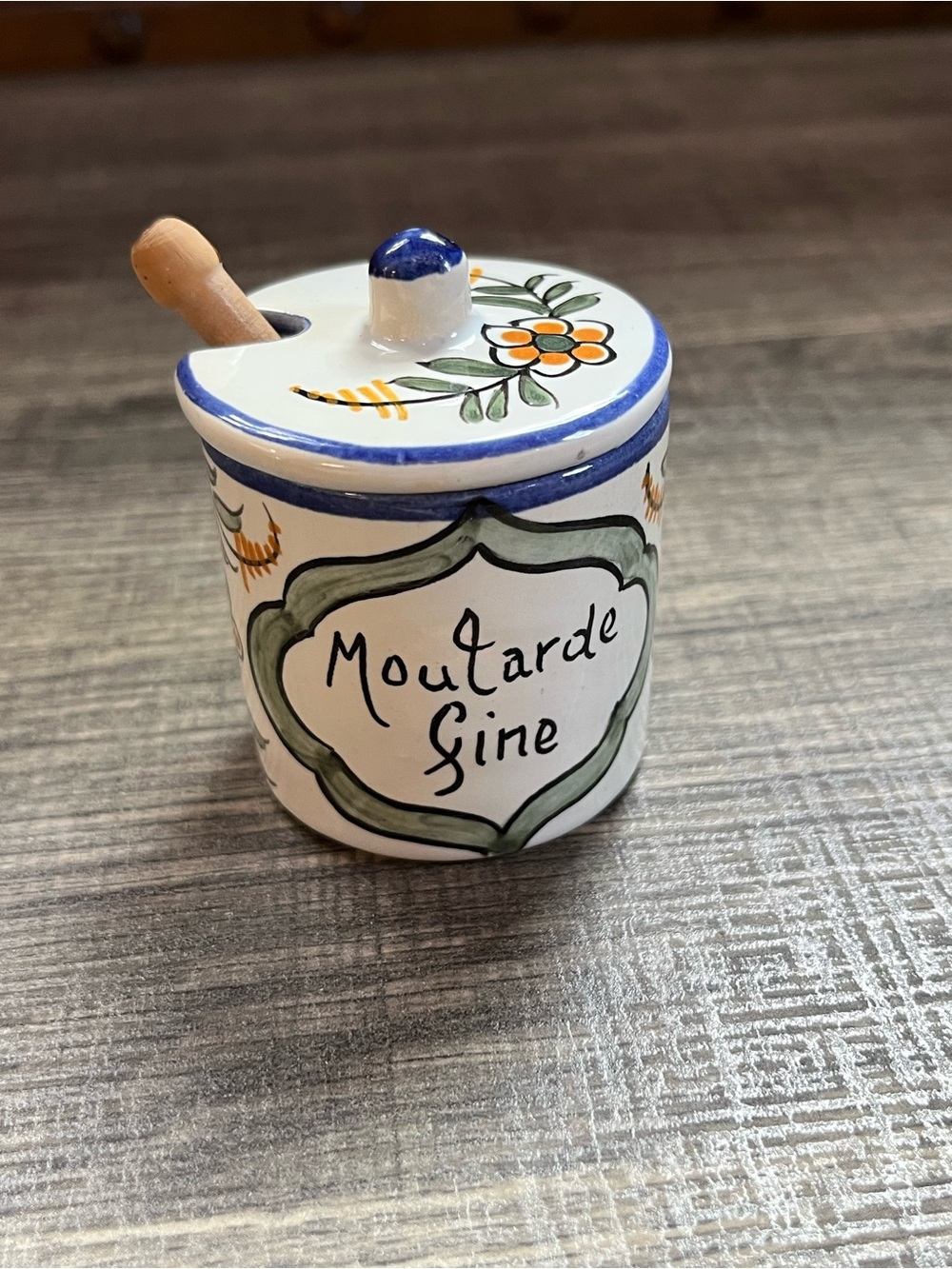 Small homemade French hand painted mustard jar with wooden spoon. Ceramic